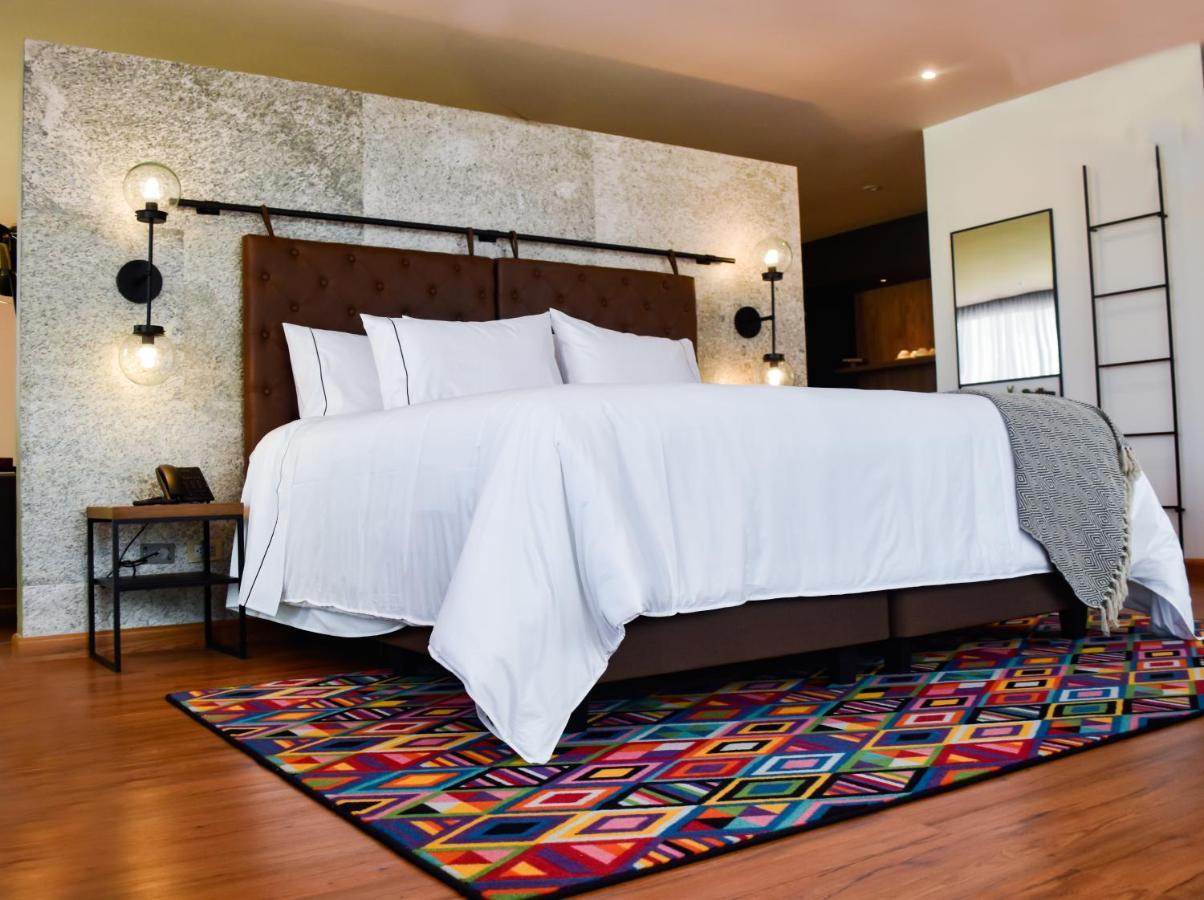 Hotel V1501 Pasto Eksteriør bilde A bedroom with a carpet